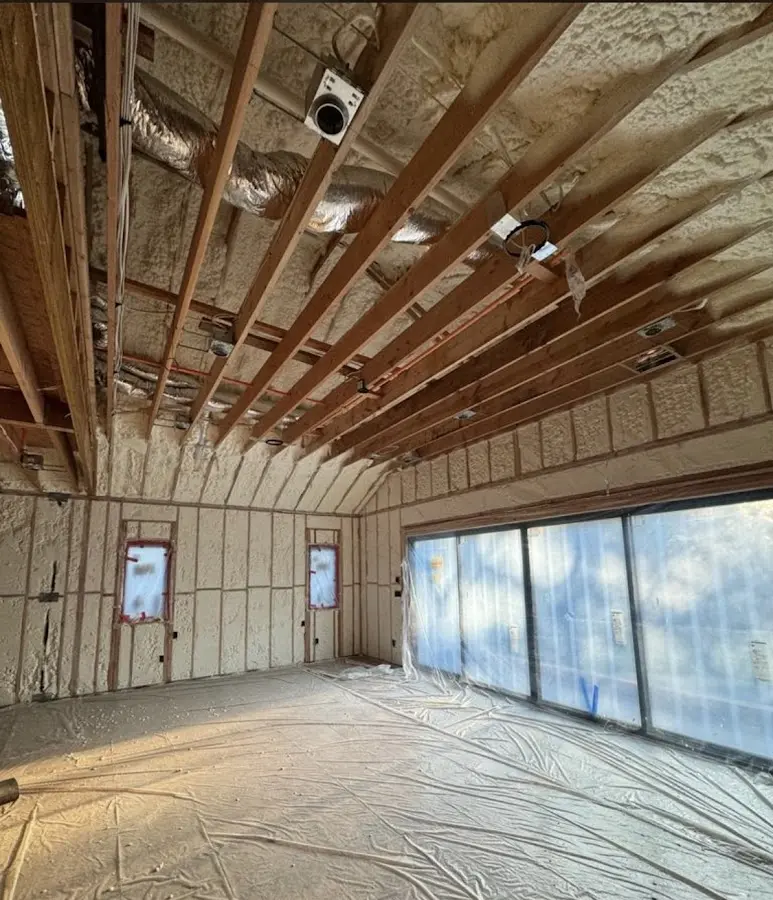 Interior walls and ceiling insulated with spray foam during new construction in McCalla